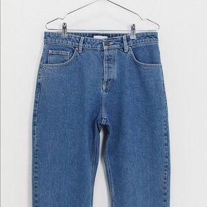 ASOS Design Relaxed Tapered Jeans in Mid Wash Blue